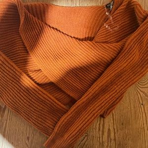 Pumpkin orange twist tie sweater.